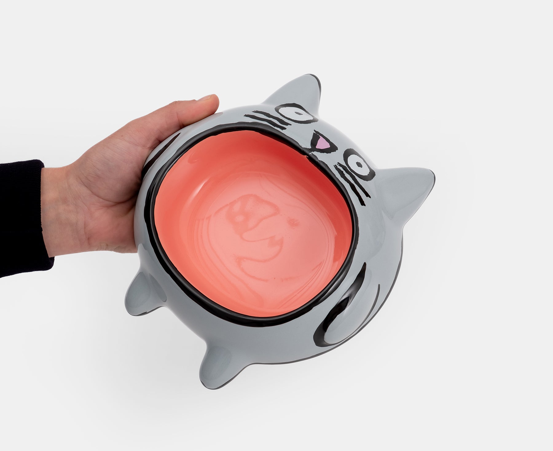 Cat Bowl by Home Studyo in a hand.