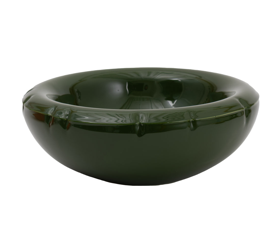 A glossy dark green ceramic Blow Up bowl with a flared rim and subtle embossed details.