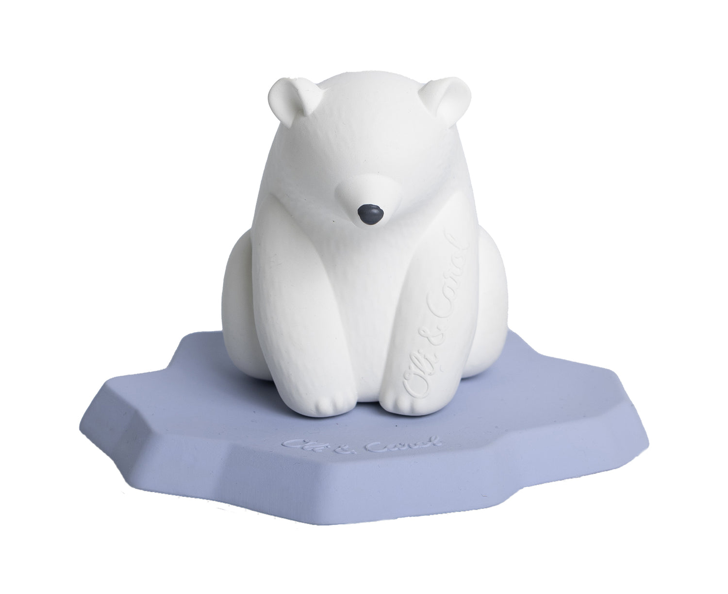 White polar bear chewable toy on a blue base of ice with Oli &amp; Carol branding.
