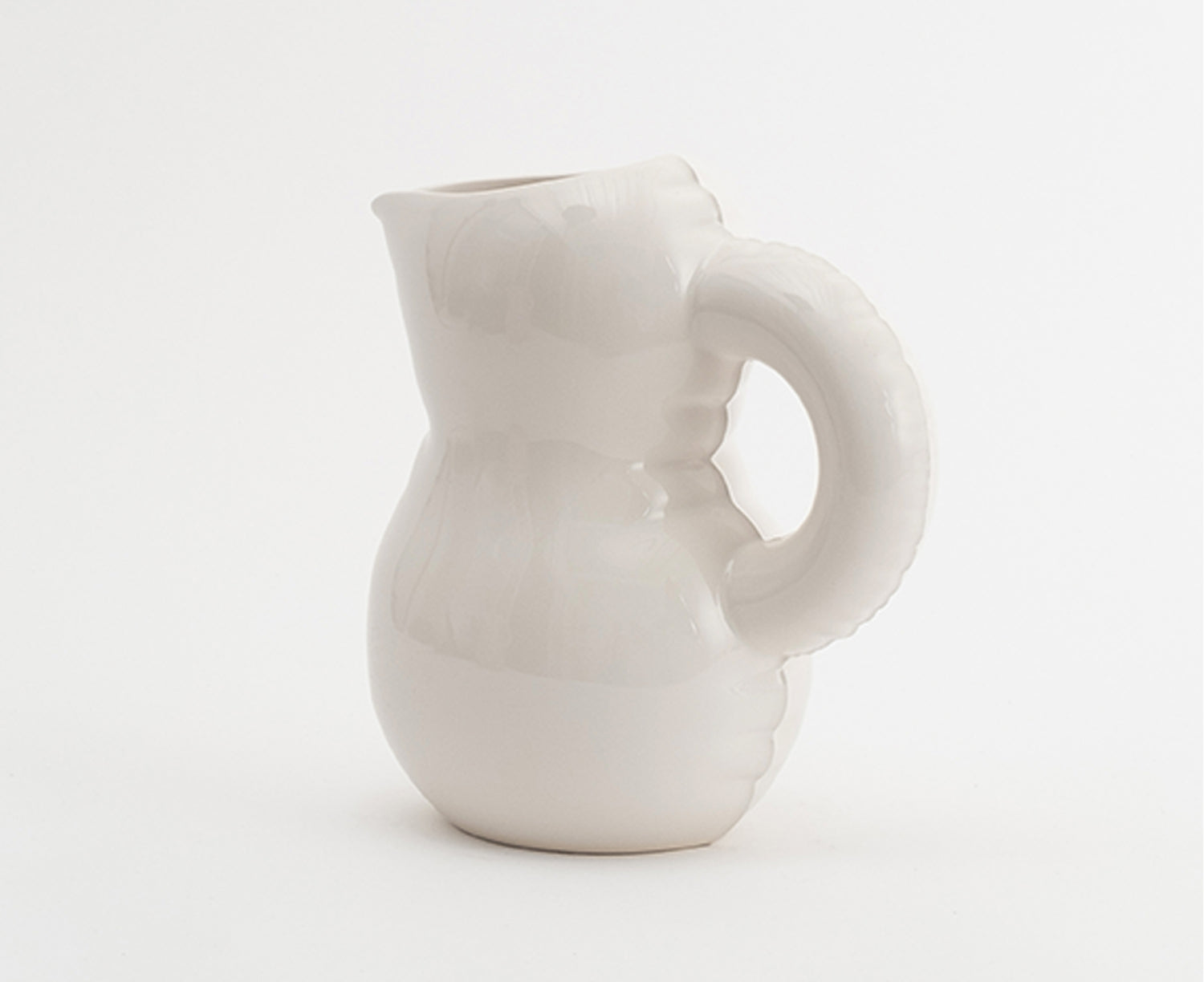 Emily Blow Up Jug in Bone by Home Studyo with a rounded, sculptural design, featuring a textured body.