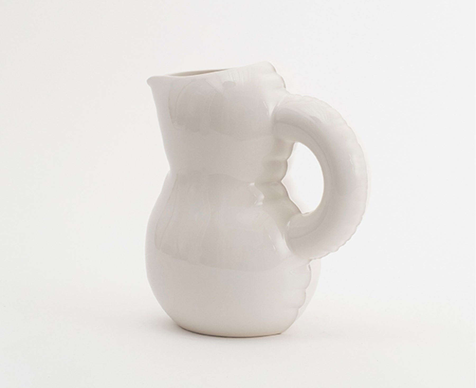 Emily Blow Up Jug in Bone by Home Studyo with a rounded, sculptural design, featuring a textured body.