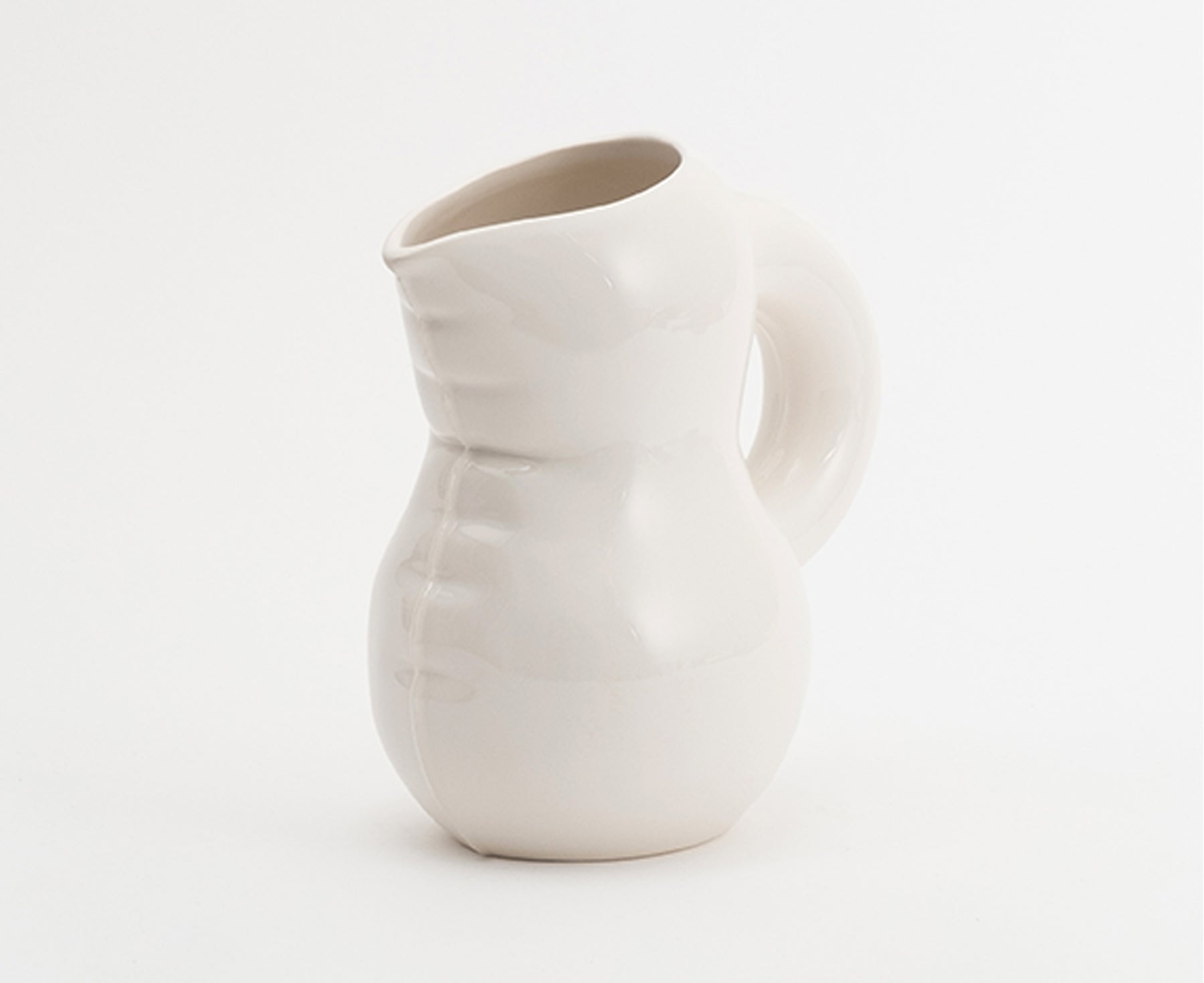 Emily Blow Up Jug in Bone by Home Studyo with a rounded, sculptural design, featuring a textured body.