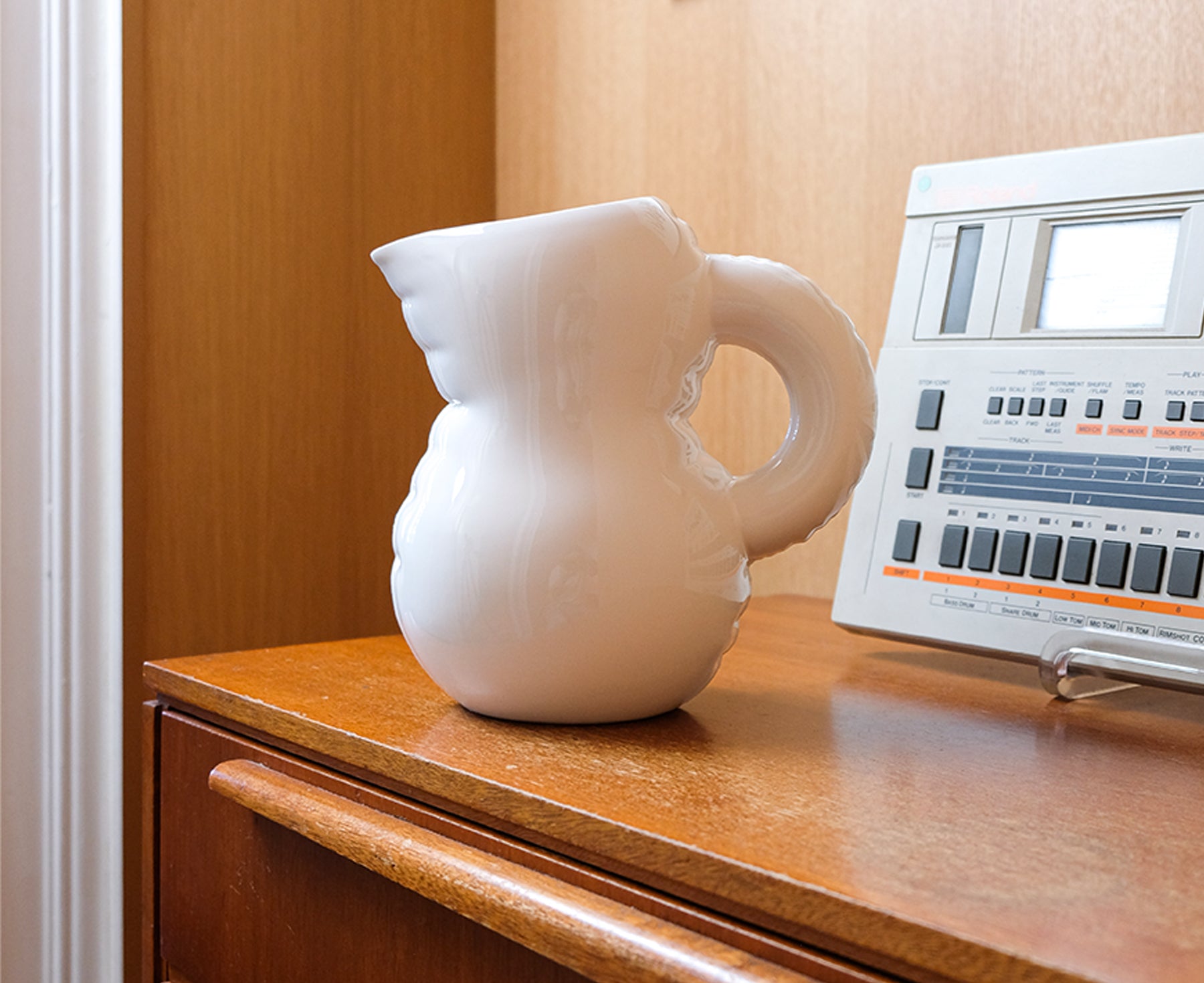 Emily Blow Up Jug in Bone by Home Studyo with a rounded, sculptural design, featuring a textured body on a sideboard.