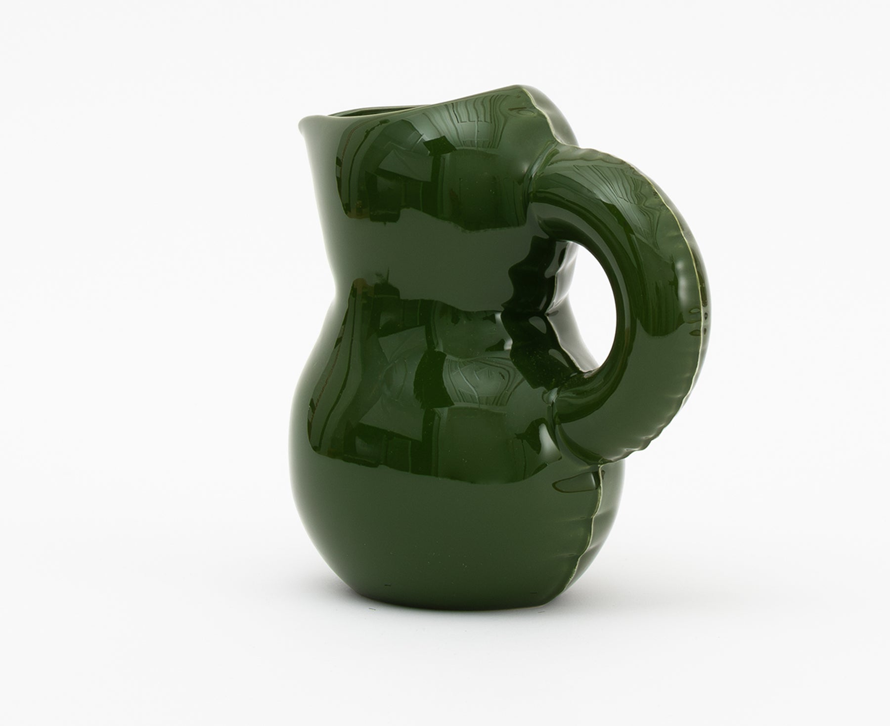 Emily Blow Up ceramic Jug in Moss Green by Home Studyo with a rounded body, ribbed texture, and a curved handle.