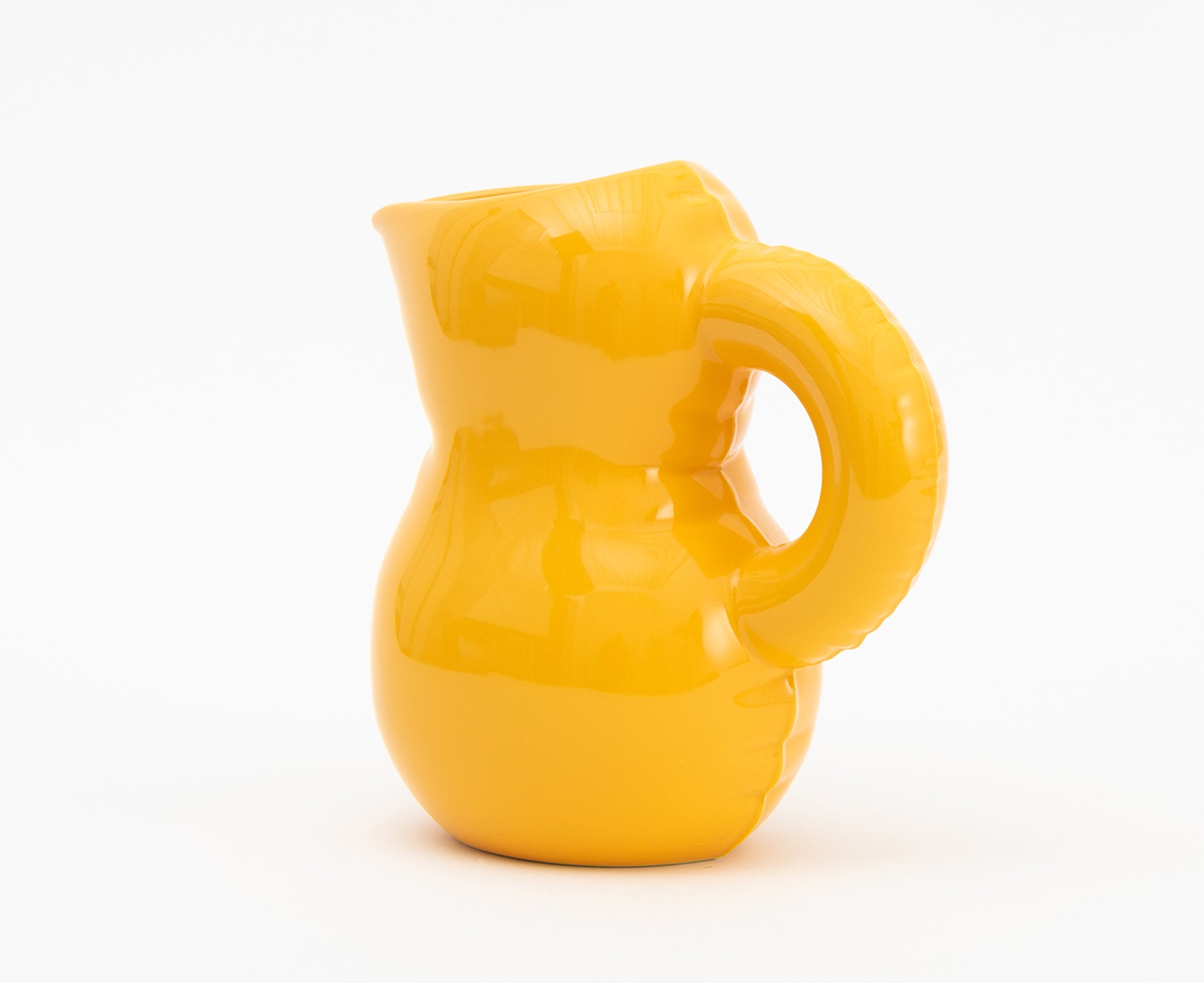Emily Blow Up Jug in Yolk by Home Studyo with a rounded, sculptural design, featuring a textured body.