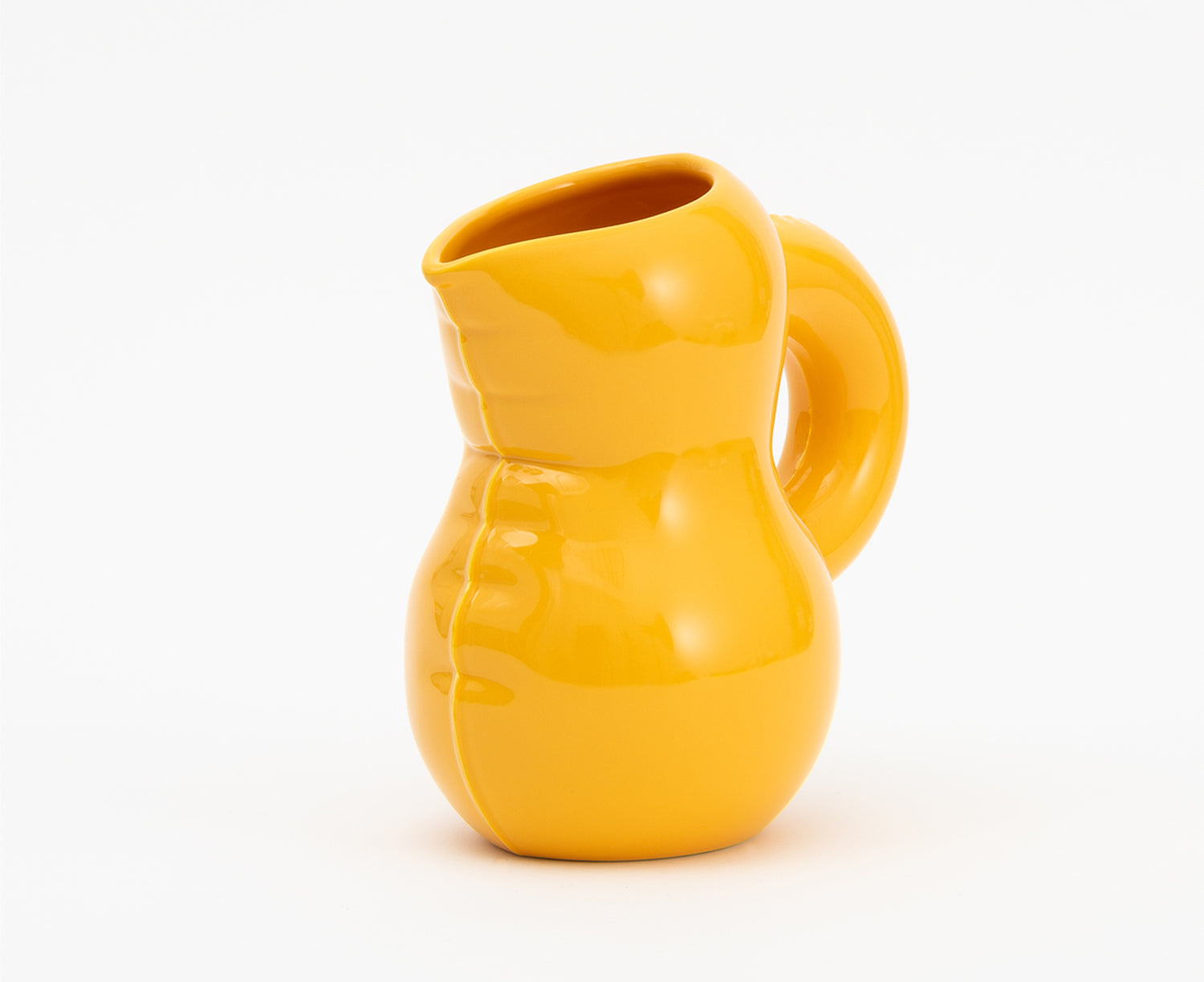 Emily Blow Up Jug in Yolk by Home Studyo with a rounded, sculptural design, featuring a textured body.