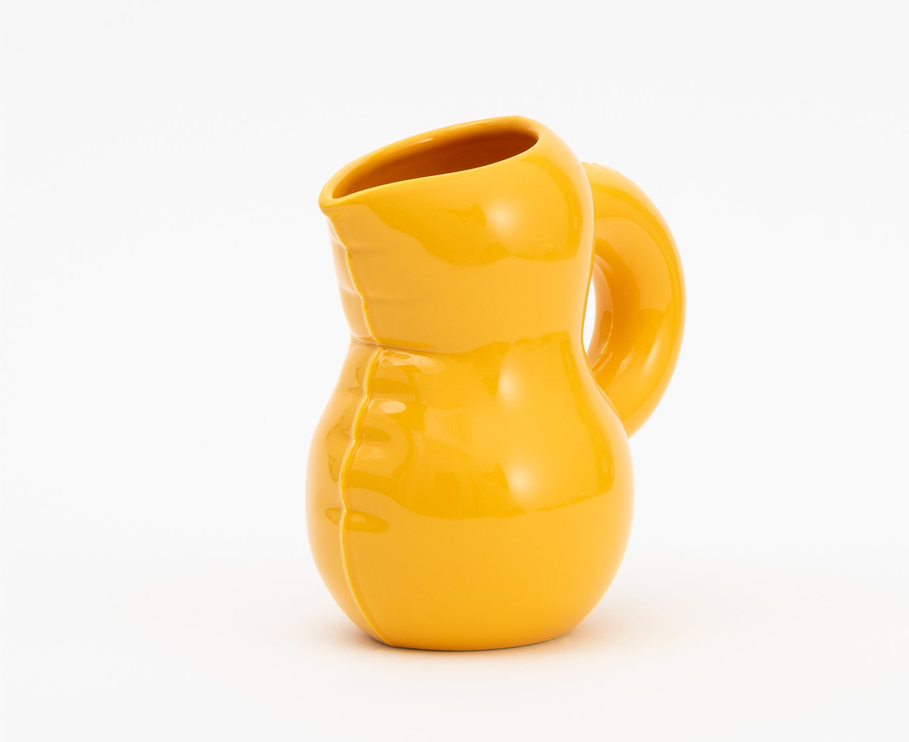 Emily Blow Up Jug in Yolk by Home Studyo with a rounded, sculptural design, featuring a textured body.