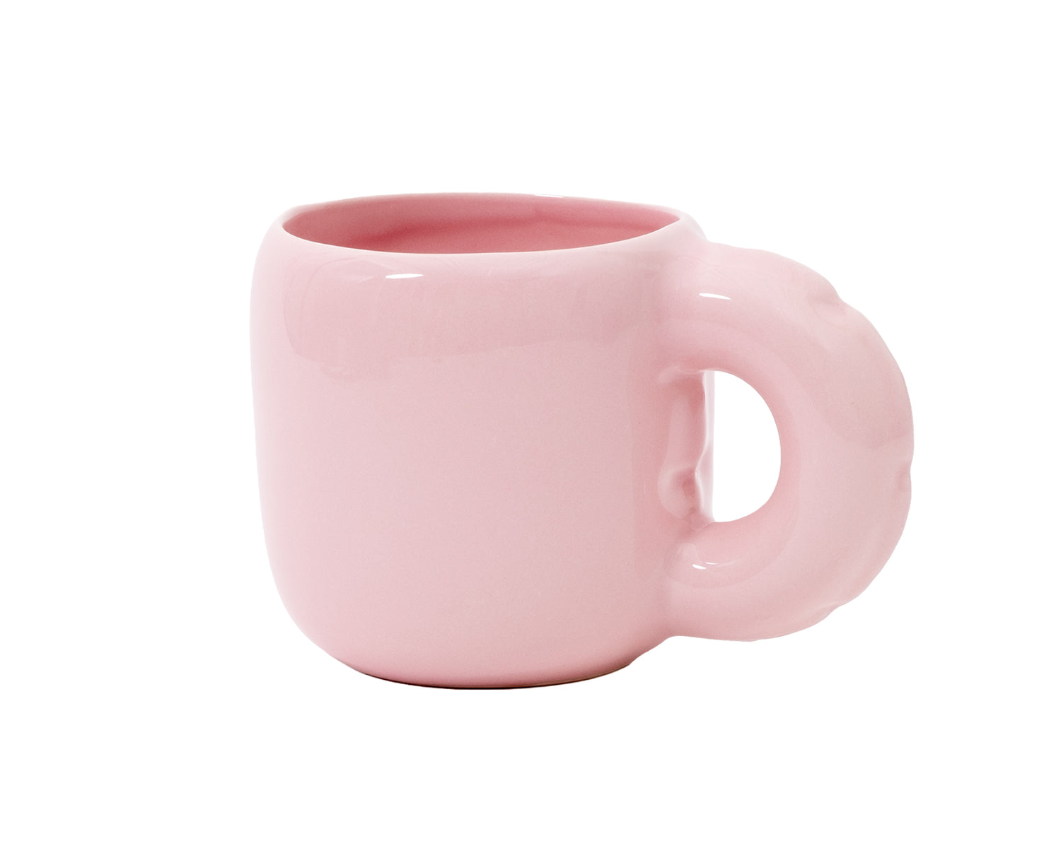 A glossy pink ceramic Gaston Blow Up Mug by Home Studyo with a sculpted, organic handle and side details.