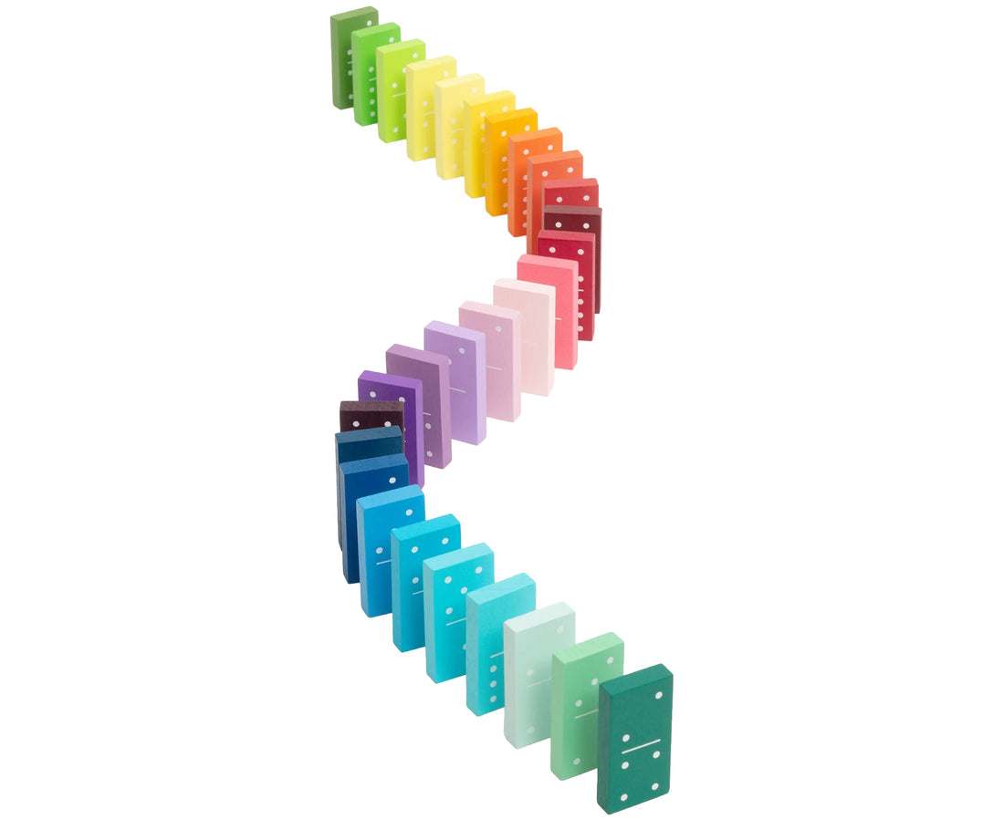 A set of colorful dominoes arranged in a curved, cascading line on a plain white background. The dominoes come in many different colors including green, yellow, orange, red, pink, purple, blue, and teal.
