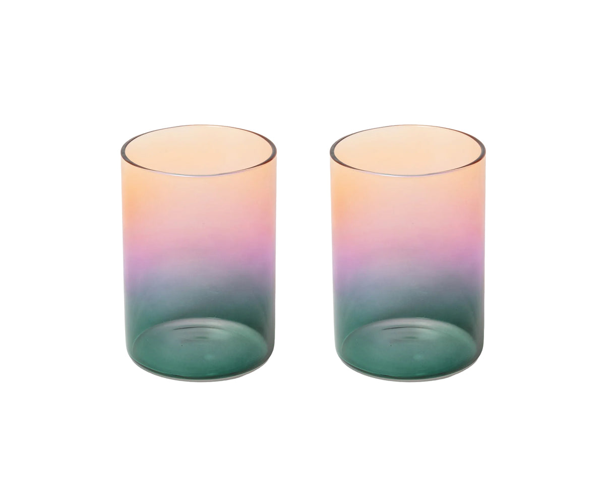 Two matching translucent tumblers with a vertical gradient design transitioning from peach-pink at the top to purple in the middle and teal-green at the bottom, shown on a plain white background.