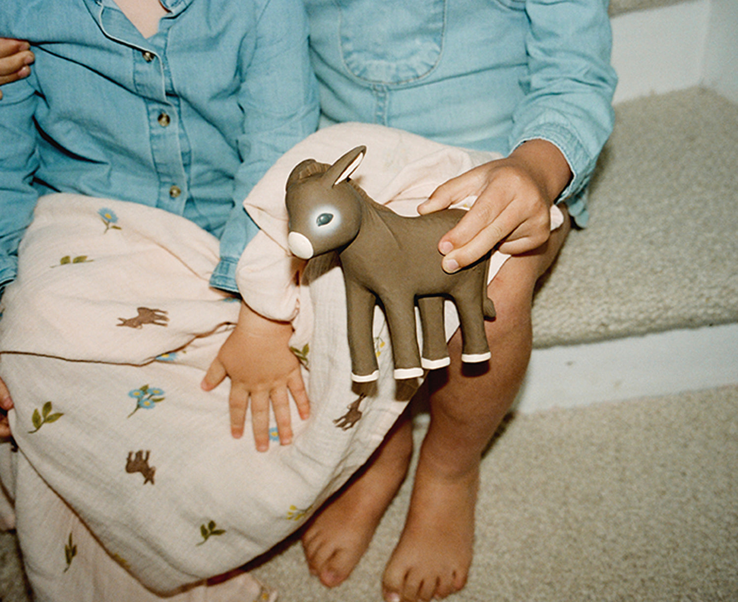 Hector the Donkey Chewable Toy by Oli &amp; Carol in the hands of a child.