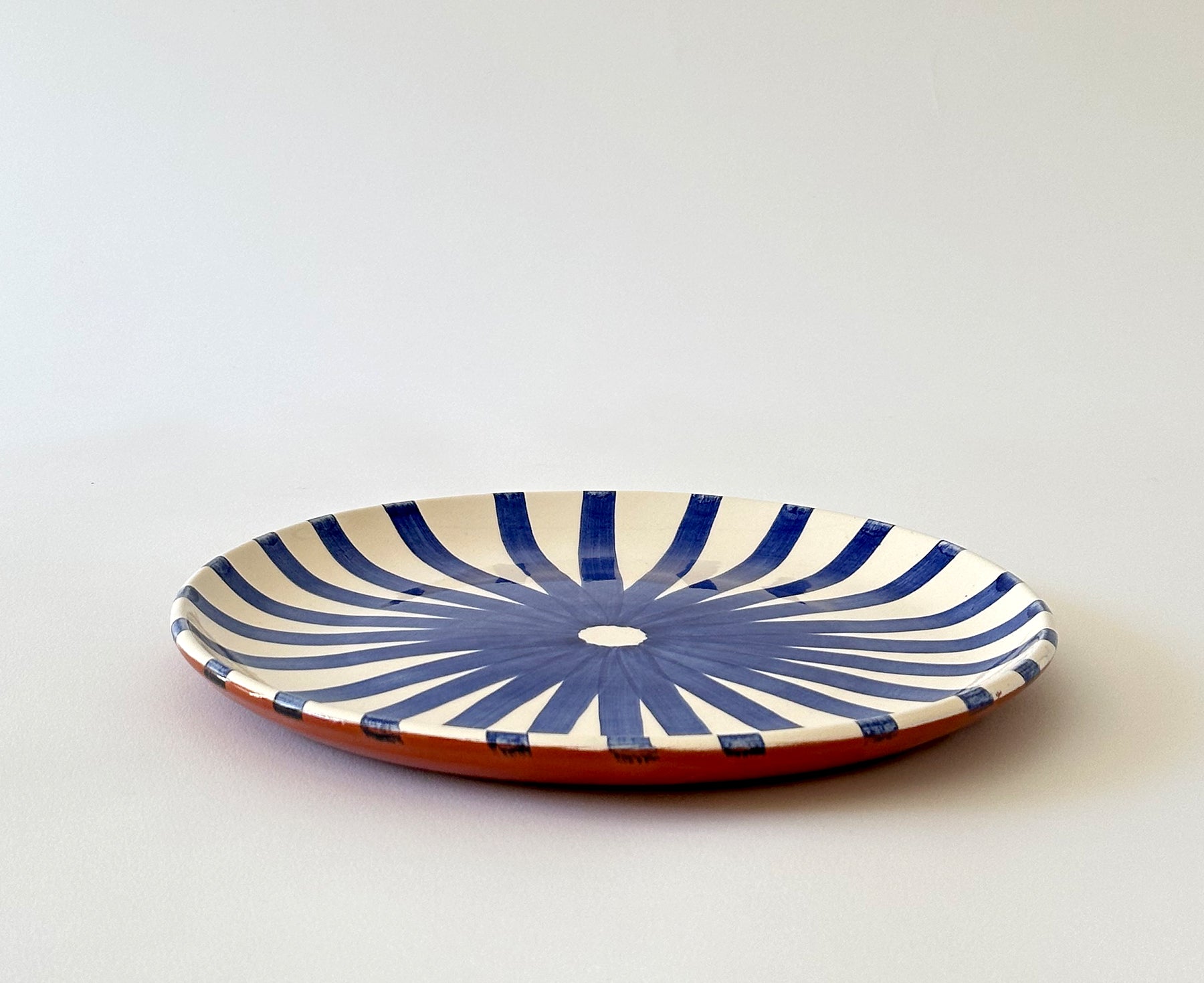 Ray Terracotta Dinner Plate in Blue by Casa Cubista