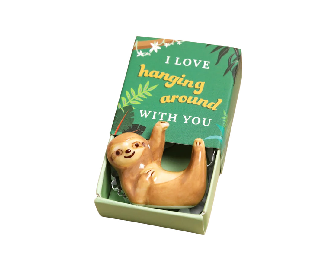 mini ceramic sloth in a matchbox