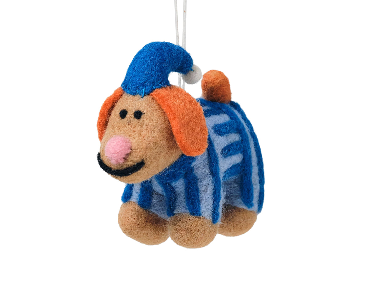 A felt dog Christmas ornament wearing a blue pointed hat and a blue-and-white striped sweater, with orange floppy ears and a pink nose.