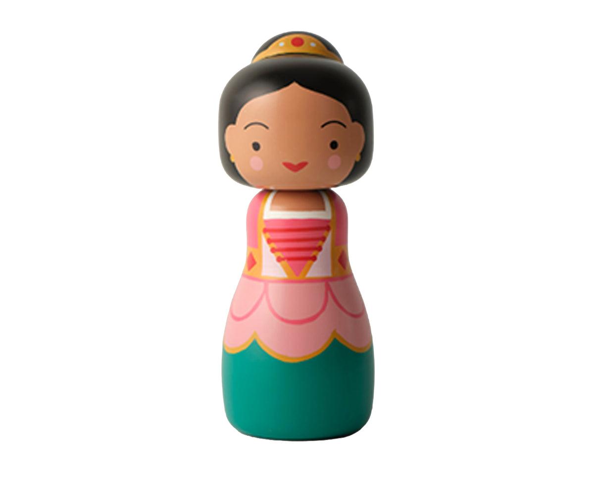 A stylized wooden Sugarplum Fairy kokeshi doll with a round head, black hair, a gold crown, and a pink and teal dress, shown on a plain white background.