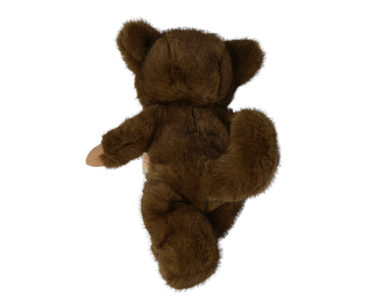 A plush werewolf cozy dinkum doll wearing a brown hooded outfit with floppy ears shown from the back.