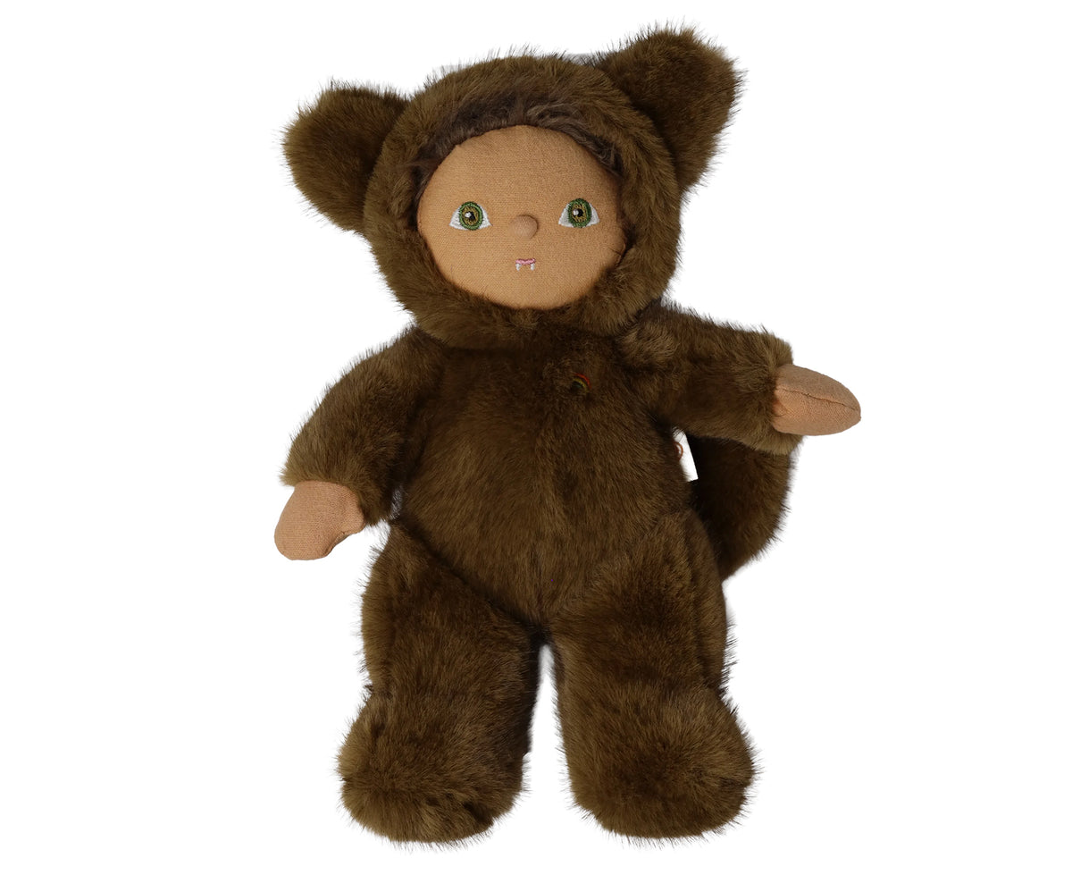 A plush toy doll dressed in a brown furry hooded outfit with bear-like ears, tan skin, green eyes, and small pink lips, photographed against a plain white background.